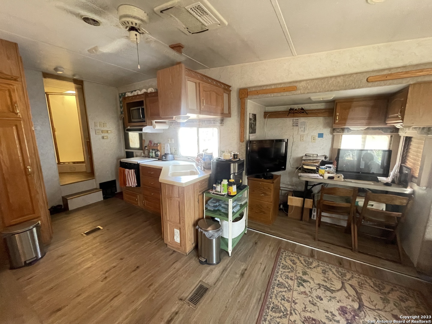 792 Alamo Beach Road Pipe Creek, TX 78063 - Photo 39 of 70 a living room with furniture and a flat screen tv