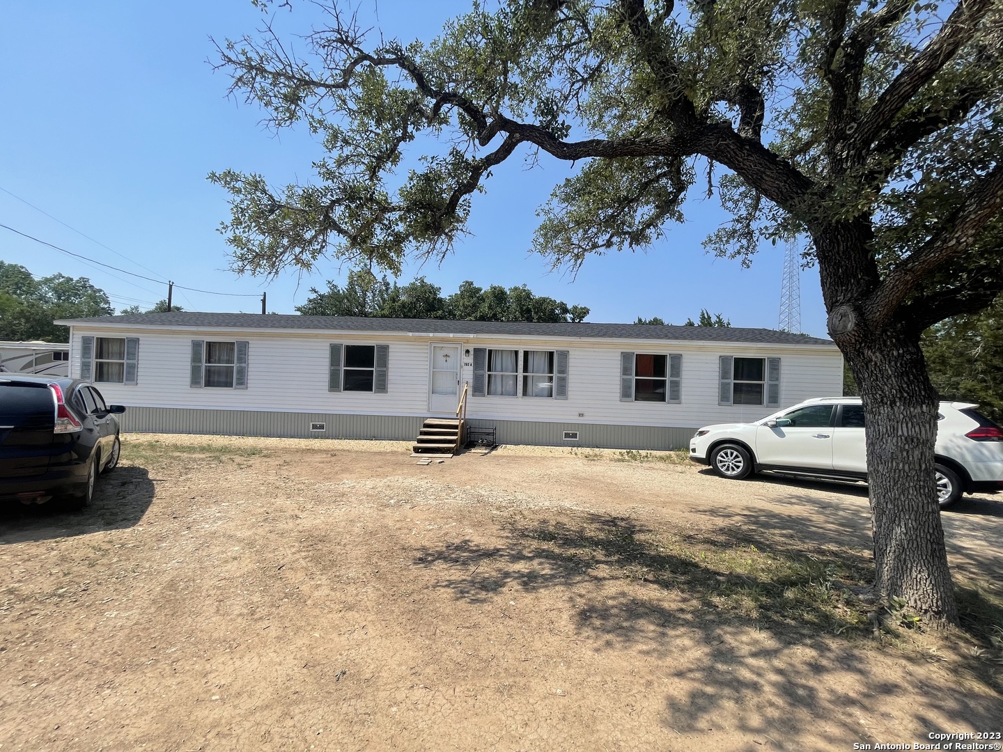 792 Alamo Beach Road Pipe Creek, TX 78063 - Photo 46 of 70 a view of a house with a patio