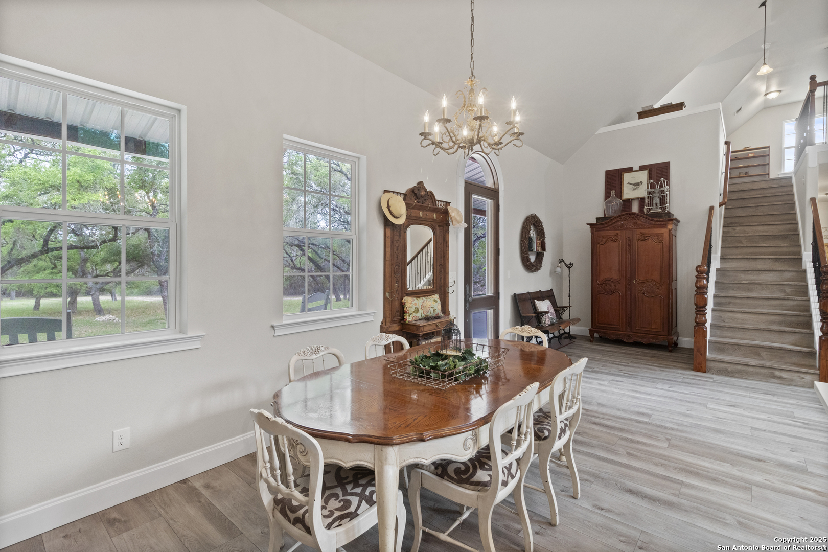 792 Alamo Beach Road Pipe Creek, TX 78063 - Photo 5 of 70 a view of a dining room with furniture window and wooden floor