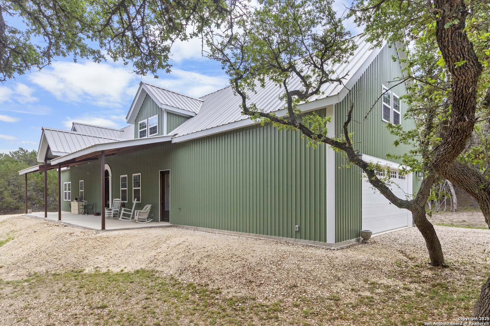 792 Alamo Beach Road Pipe Creek, TX 78063 - Photo 65 of 70 a view of a house with a yard and tree