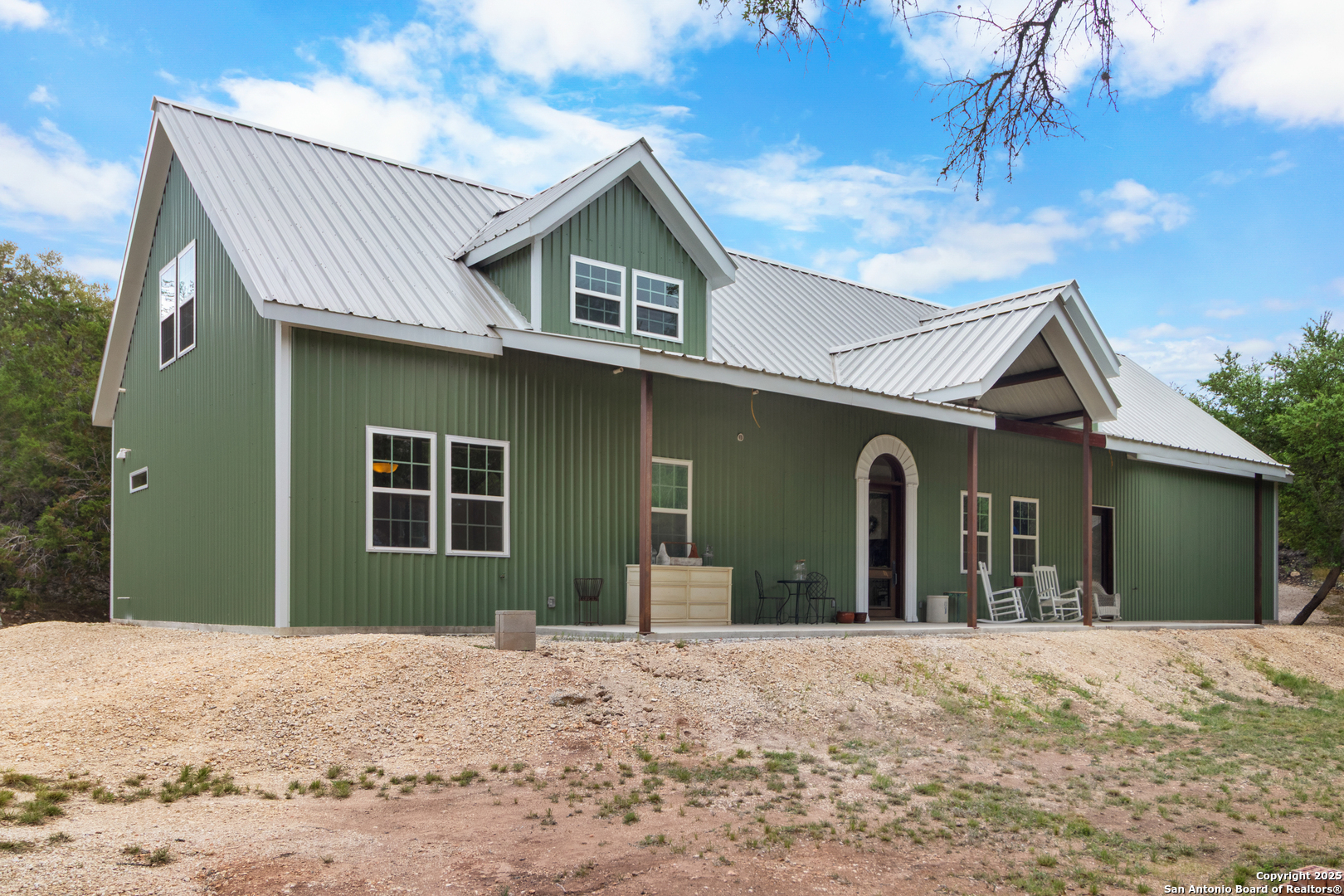 792 Alamo Beach Road Pipe Creek, TX 78063 - Photo 67 of 70 a view of a house with a yard and garage