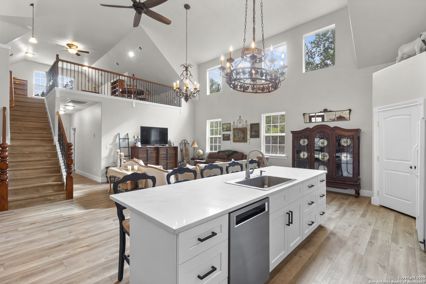 792 Alamo Beach Road Pipe Creek, TX 78063 - Photo 8 of 70 a view of a dining room with furniture wooden floor and chandelier