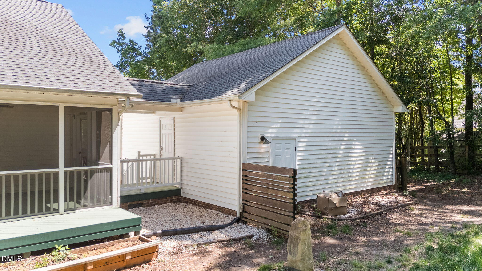 6820 Oviedo Drive Raleigh, NC 27603 - Photo 40 of 50 a view of a house with a small yard and wooden fence
