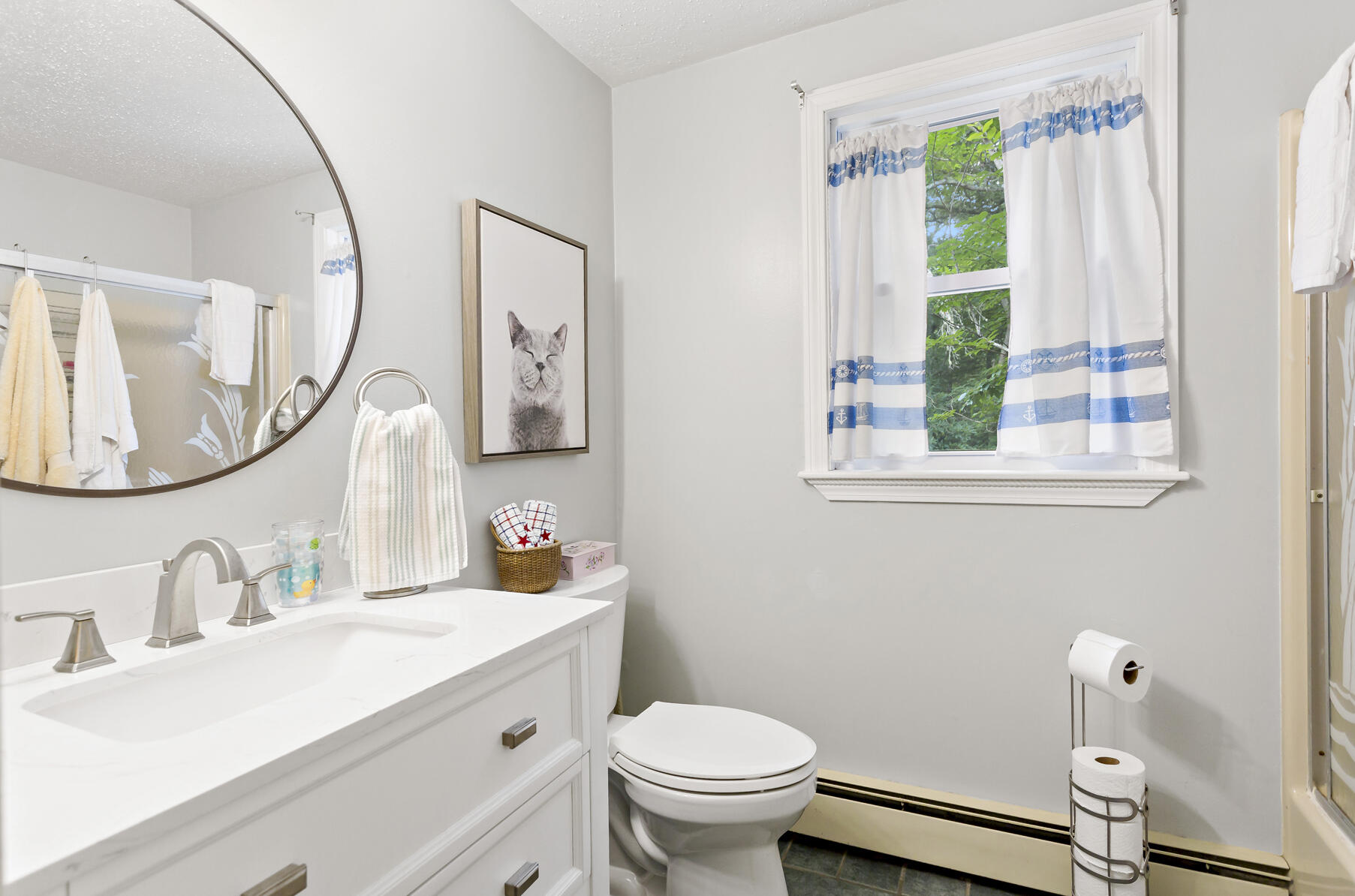 58 Saddleback Road Mashpee, MA 02649 - Photo 15 of 40 a bathroom with a sink a toilet and a mirror