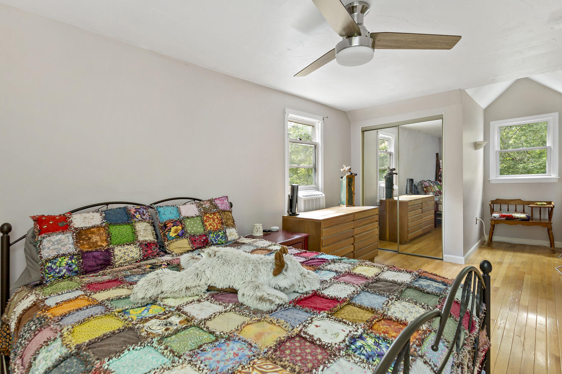 58 Saddleback Road Mashpee, MA 02649 - Photo 16 of 40 a bed sitting in a bedroom next to a window