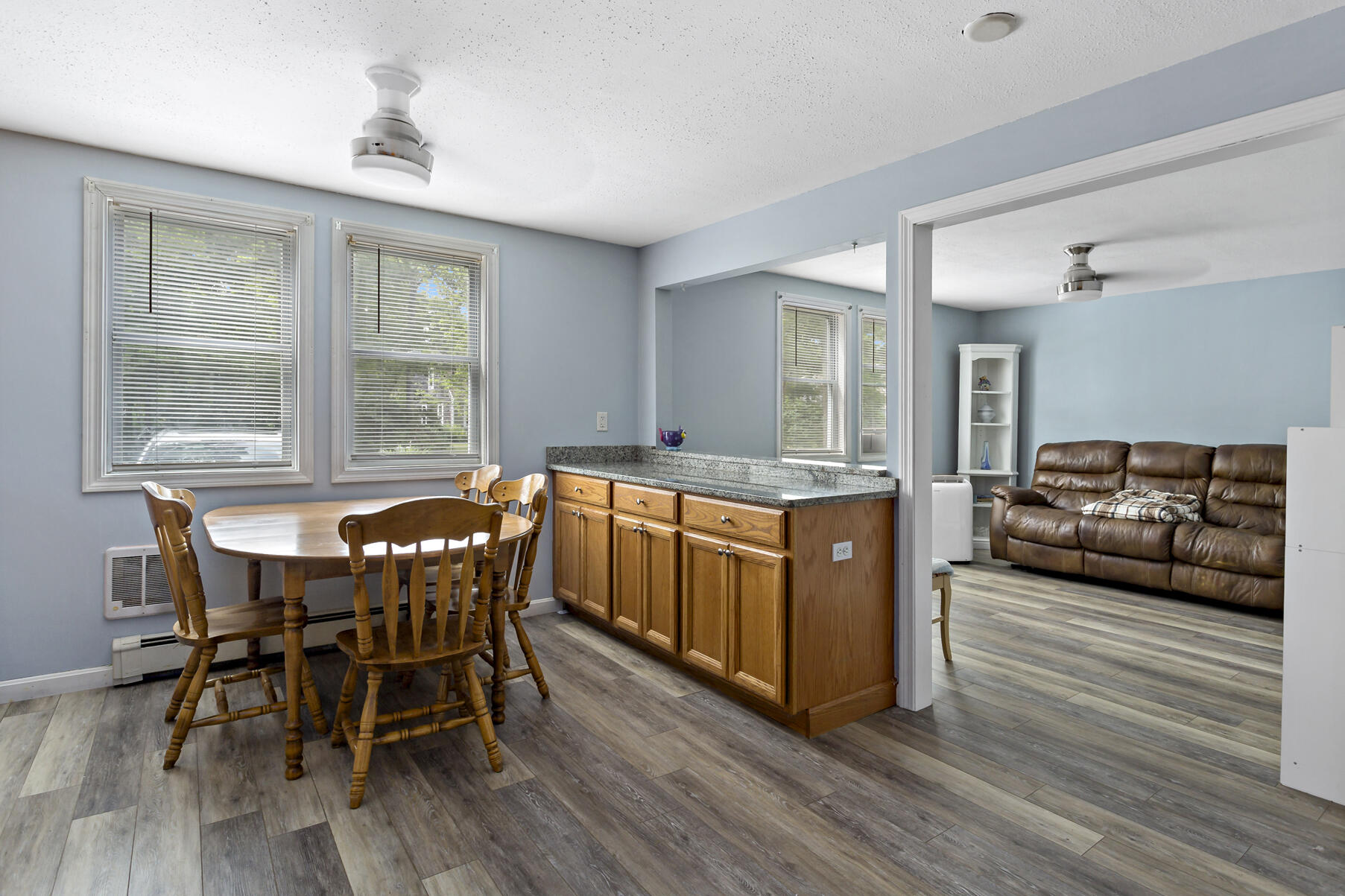 58 Saddleback Road Mashpee, MA 02649 - Photo 25 of 40 a living room with furniture a dining table and wooden floor