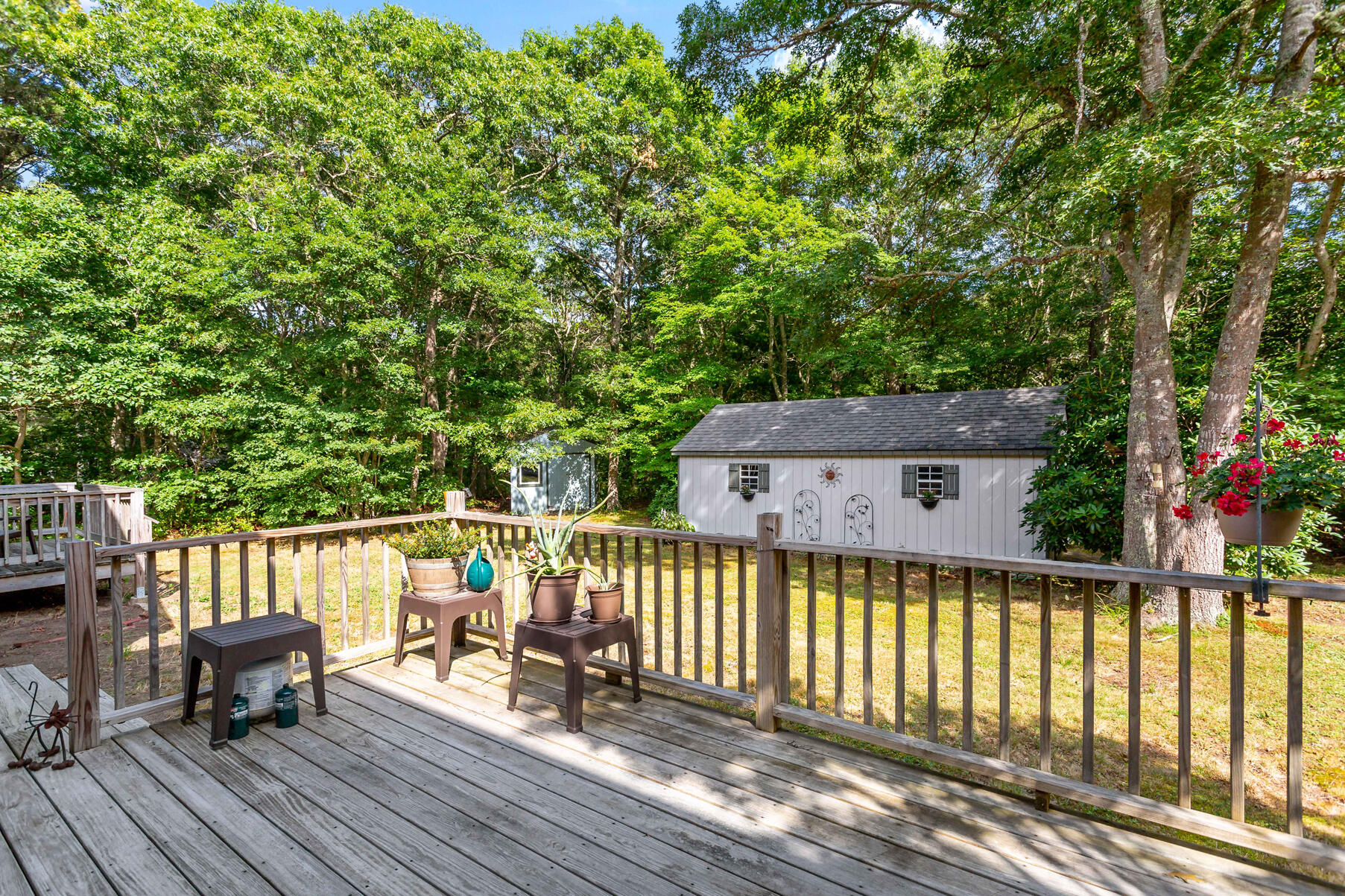 58 Saddleback Road Mashpee, MA 02649 - Photo 31 of 40 a balcony with wooden floor and fence