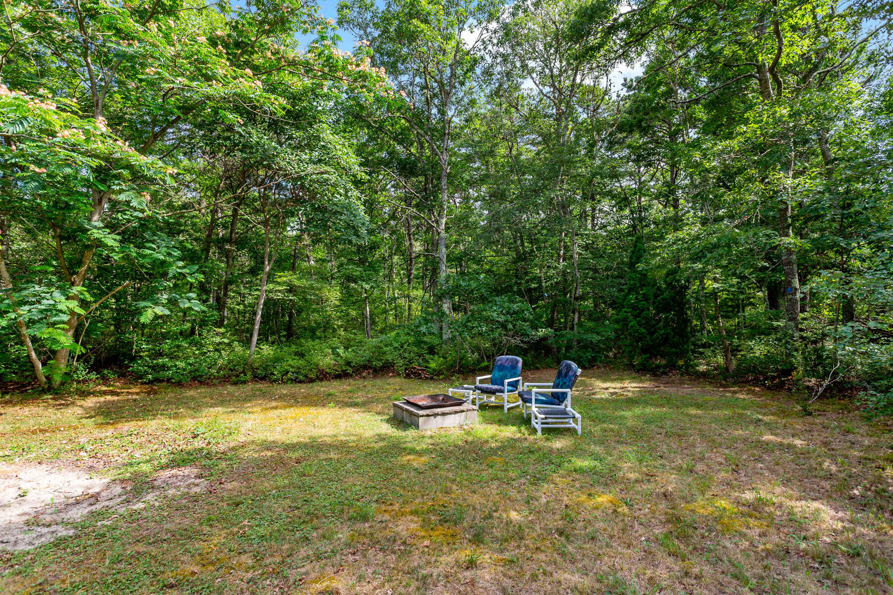 58 Saddleback Road Mashpee, MA 02649 - Photo 34 of 40 a swimming pool with a bench and trees