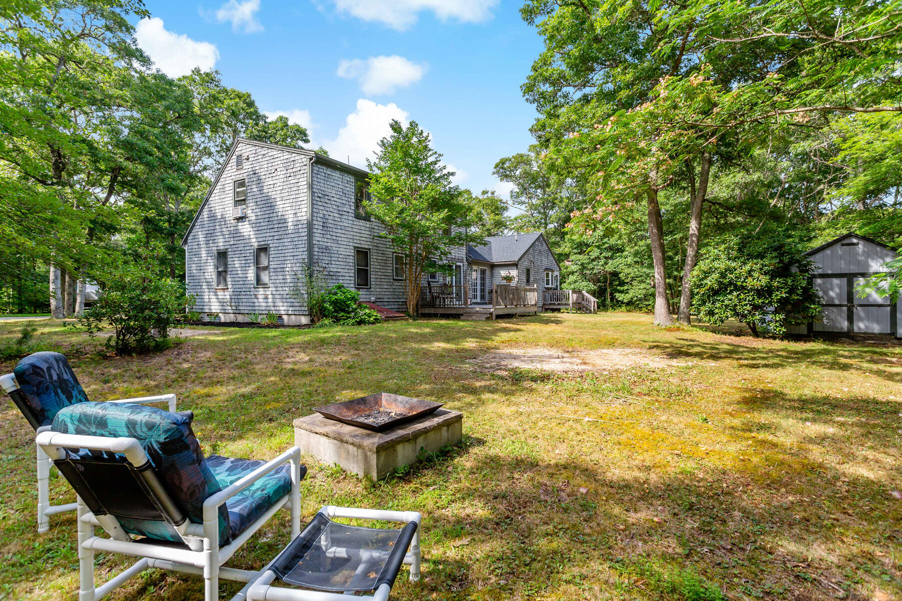 58 Saddleback Road Mashpee, MA 02649 - Photo 36 of 40 a view of a swimming pool and lounge chairs in the patio