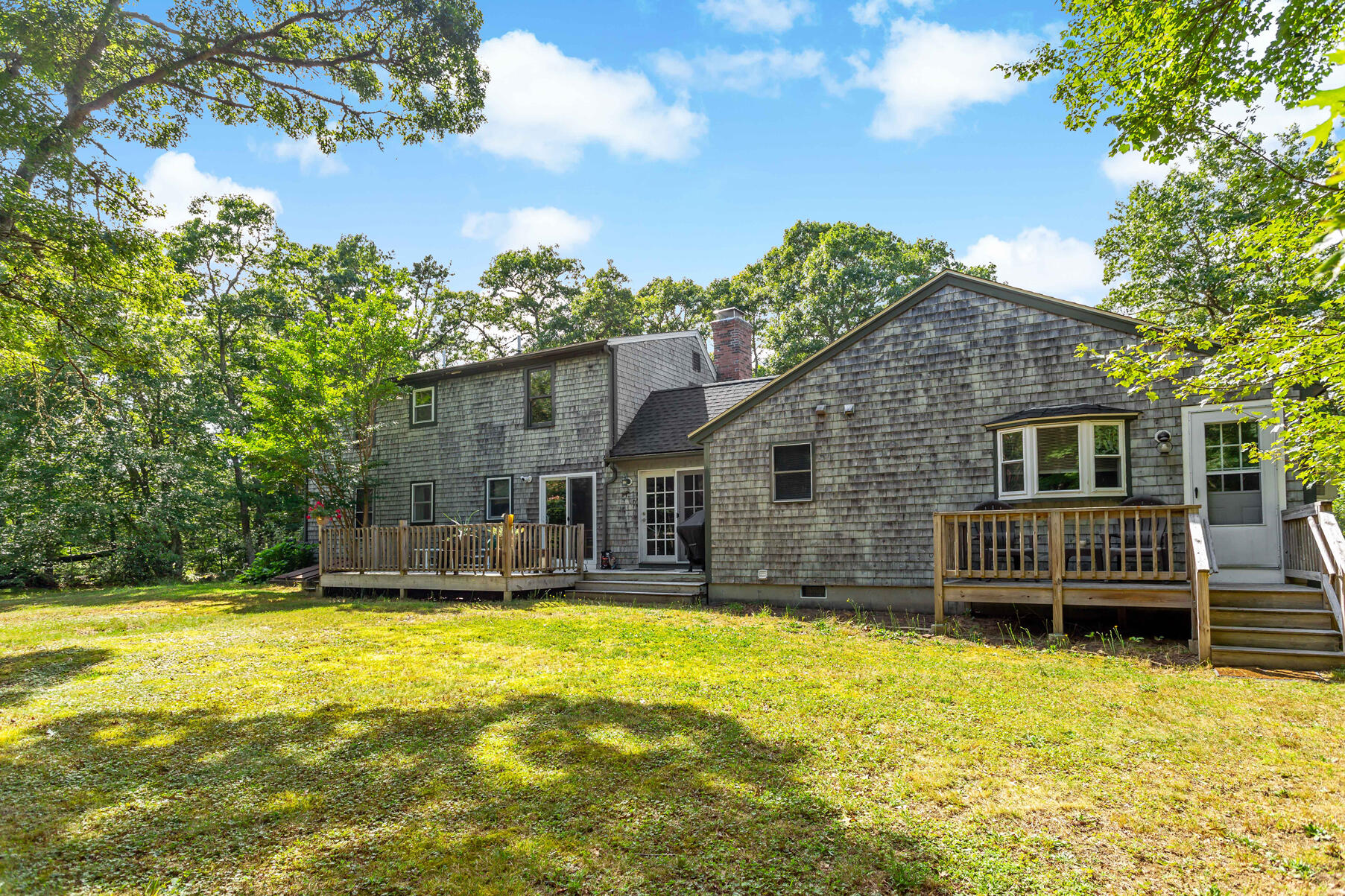 58 Saddleback Road Mashpee, MA 02649 - Photo 37 of 40 a house view with swimming pool in front of it