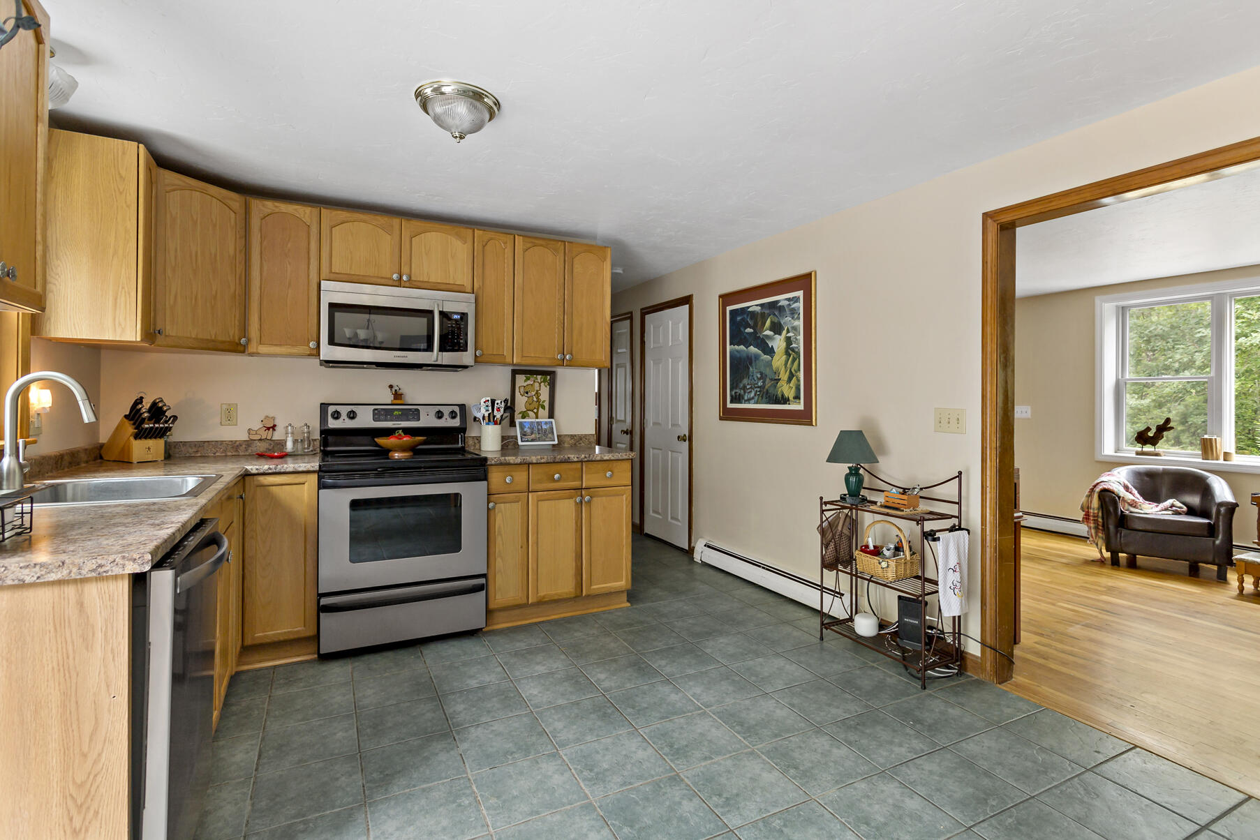 58 Saddleback Road Mashpee, MA 02649 - Photo 6 of 40 a kitchen with a sink appliances and cabinets
