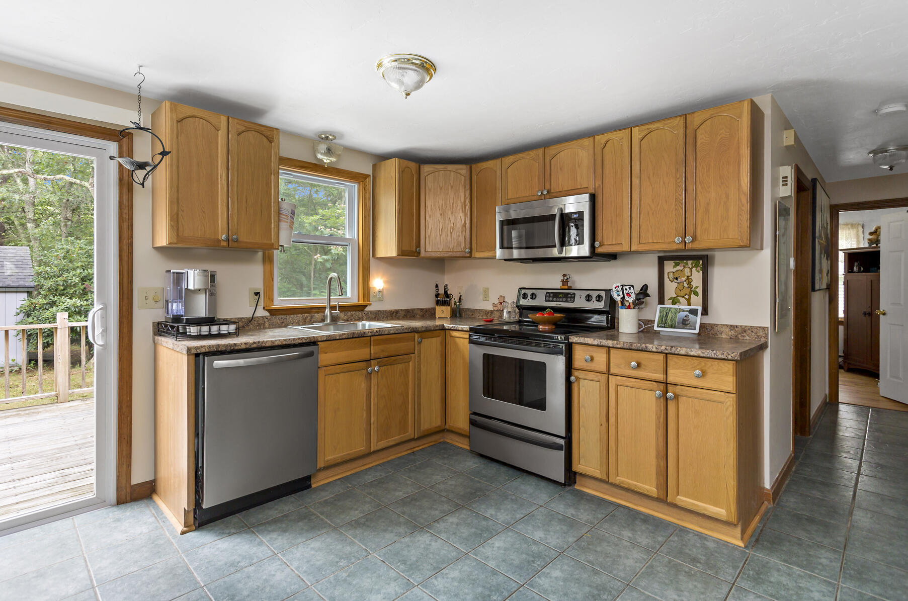 58 Saddleback Road Mashpee, MA 02649 - Photo 8 of 40 a kitchen with stainless steel appliances granite countertop a stove a sink and a refrigerator