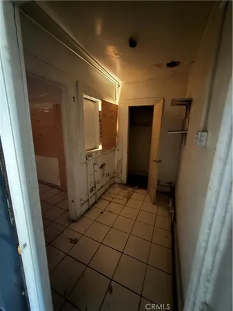a bedroom with a bed and a mirror