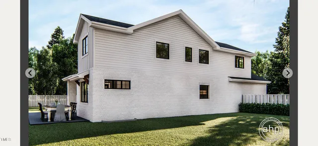 a view of house with backyard