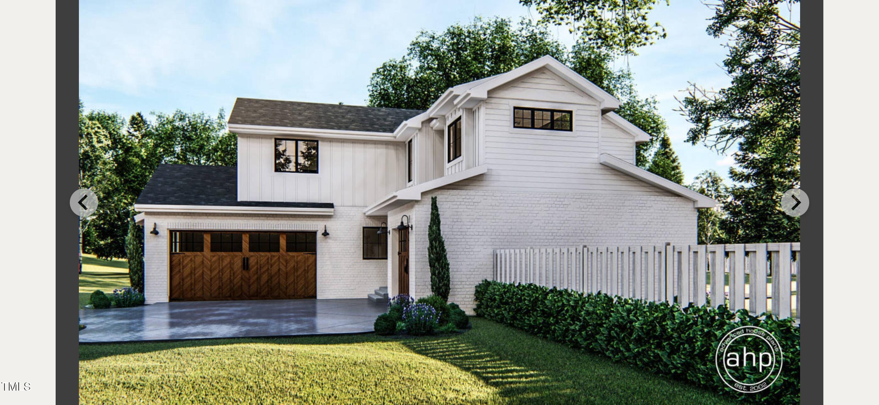 8014 Penny Road Raleigh, NC 27606 - Photo 4 of 7 a house view with a garden space