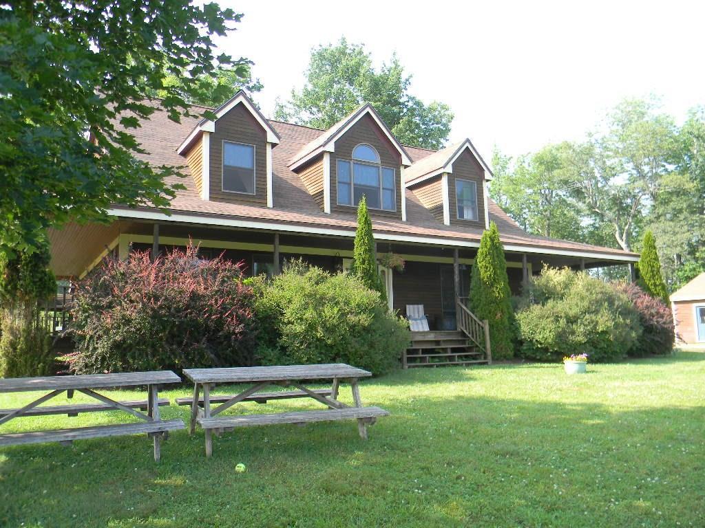 24 Frye Mountain Road Morrill, ME 04952 - Photo 2 of 35 Front porch and landscaping