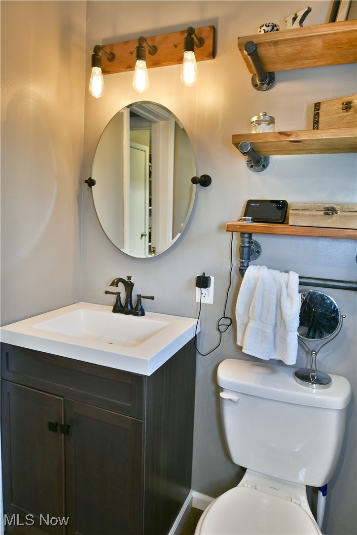 600 Prentice Road Northwest Warren, OH 44481 - Photo 21 of 47 Bathroom with toilet and vanity