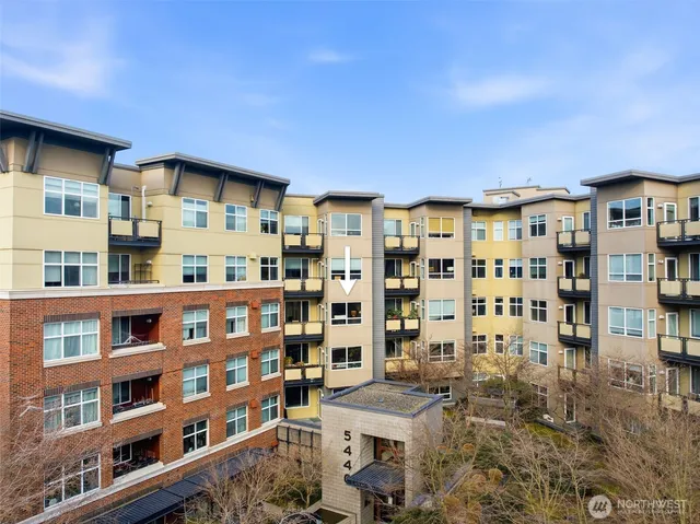 a living room with furniture and kitchen view