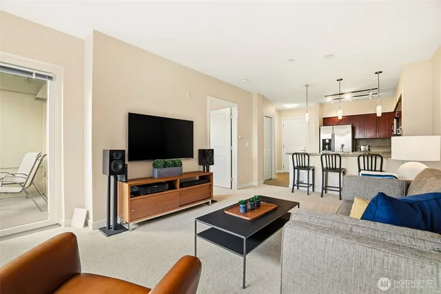 a kitchen with stainless steel appliances granite countertop a sink stove and microwave