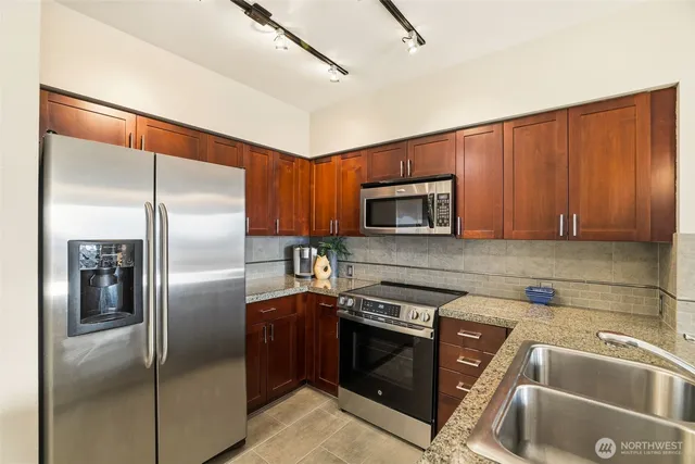 a kitchen with counter top space and sink
