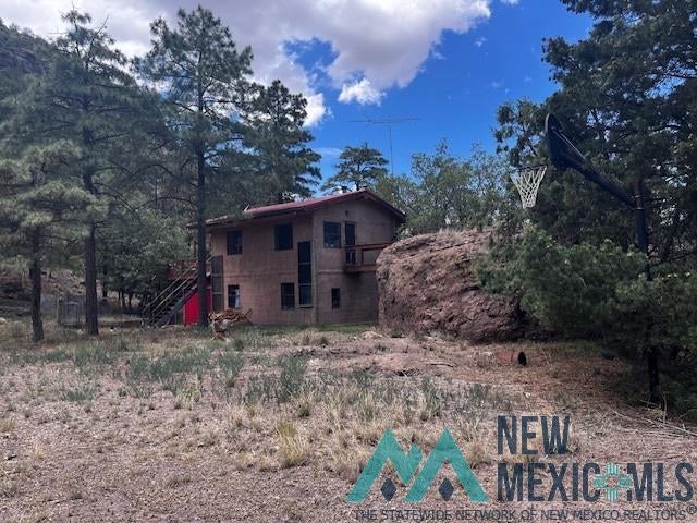 375 Hop Canyon Road Magdalena, NM 87825 - Photo 23 of 33 View of home's exterior featuring stairway