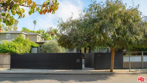 a view of a house with a tree