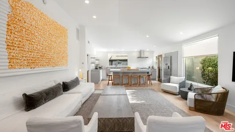 a living room with furniture and windows