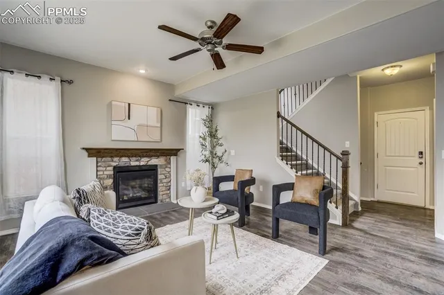 a living room with furniture and a fireplace