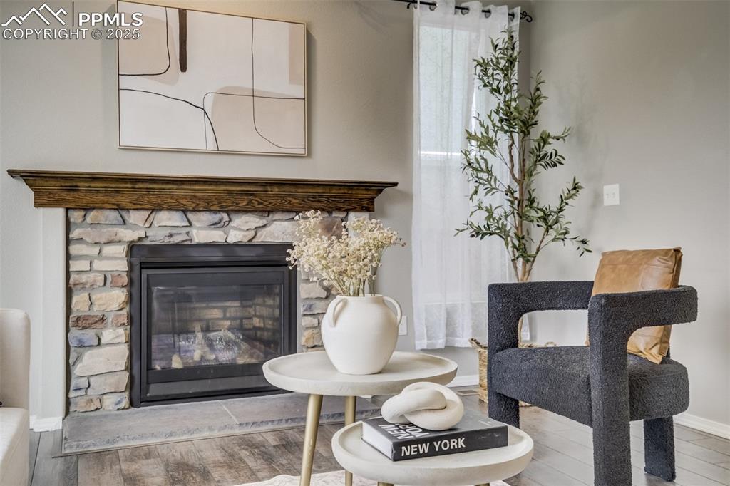 3410 Daydreamer Drive Colorado Springs, CO 80908 - Photo 12 of 50 a living room with furniture and a fireplace