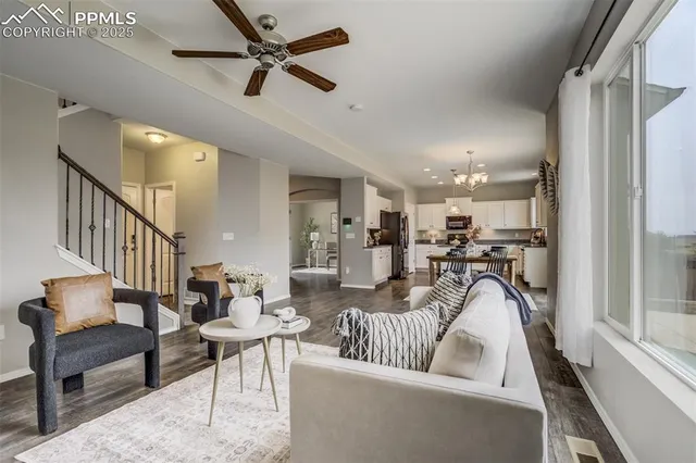 a living room with furniture and a table