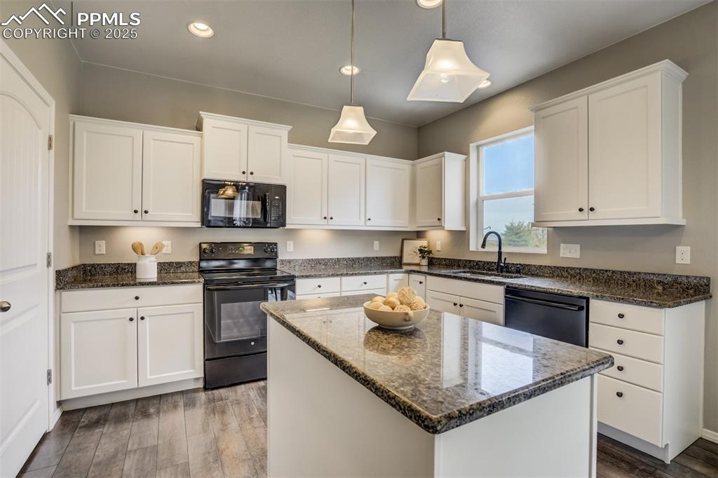 3410 Daydreamer Drive Colorado Springs, CO 80908 - Photo 17 of 50 a kitchen with stainless steel appliances granite countertop a sink stove and cabinets