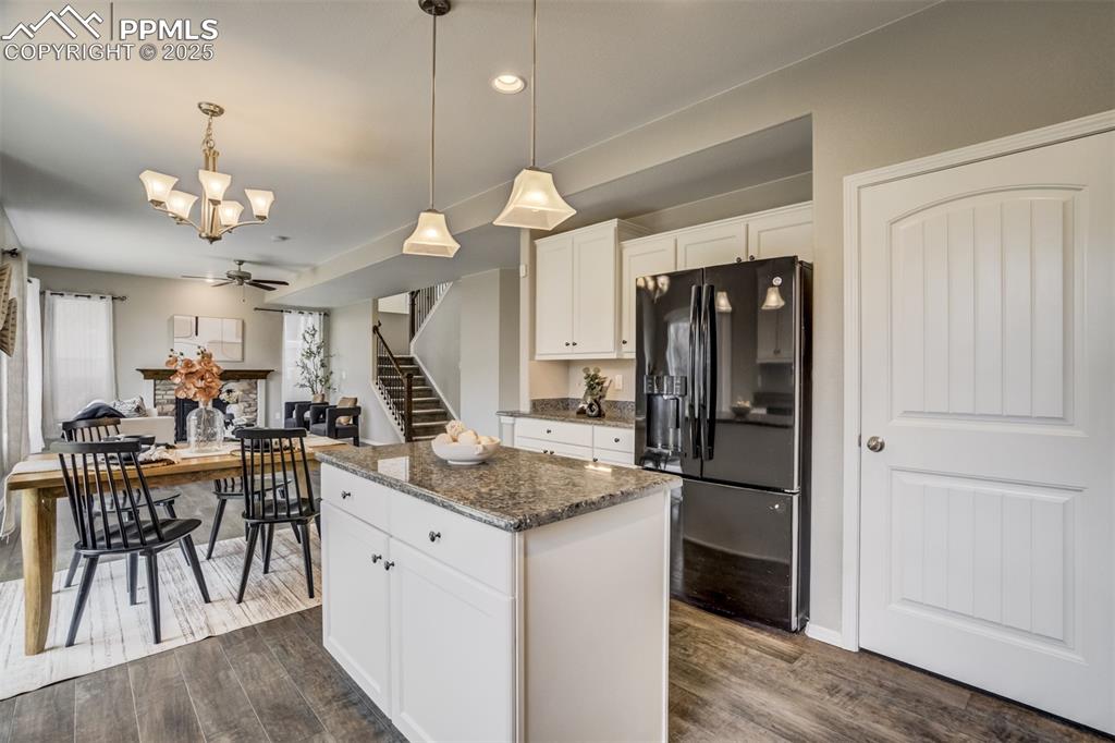 3410 Daydreamer Drive Colorado Springs, CO 80908 - Photo 20 of 50 a kitchen with a table chairs and refrigerator