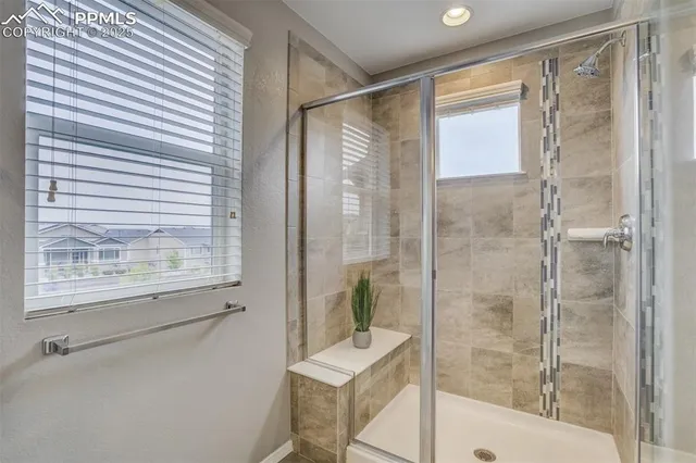 a bathroom with a shower and a bathtub
