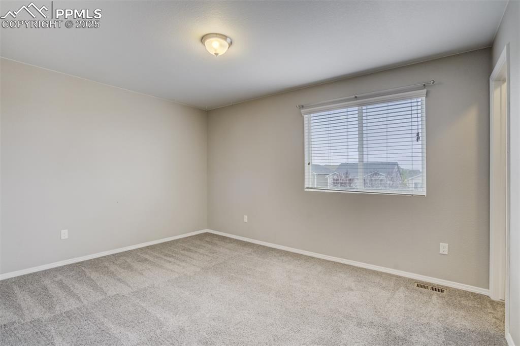 3410 Daydreamer Drive Colorado Springs, CO 80908 - Photo 33 of 50 an empty room with a window