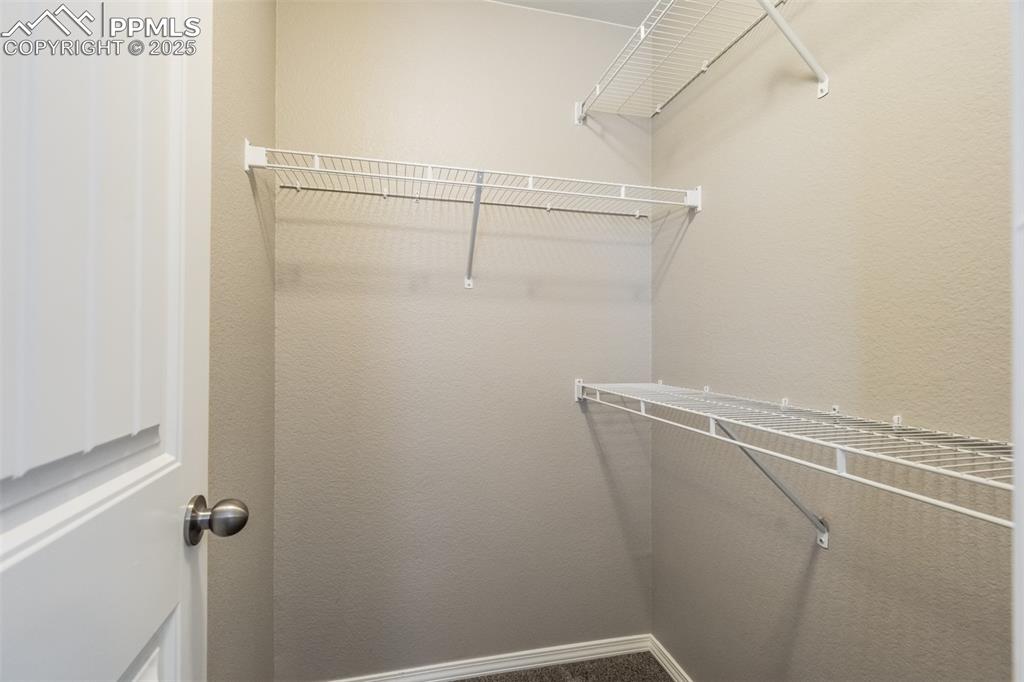 3410 Daydreamer Drive Colorado Springs, CO 80908 - Photo 35 of 50 a view of a room with racks on the wall