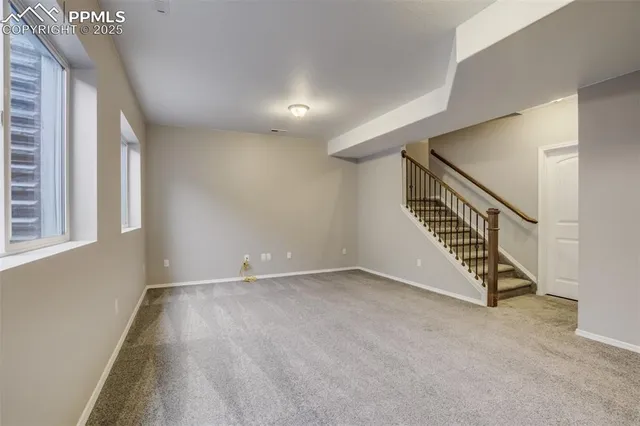 a view of an empty room with stairs