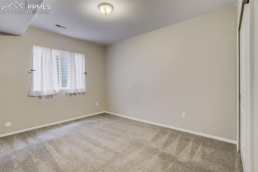 3410 Daydreamer Drive Colorado Springs, CO 80908 - Photo 40 of 50 an empty room with a window