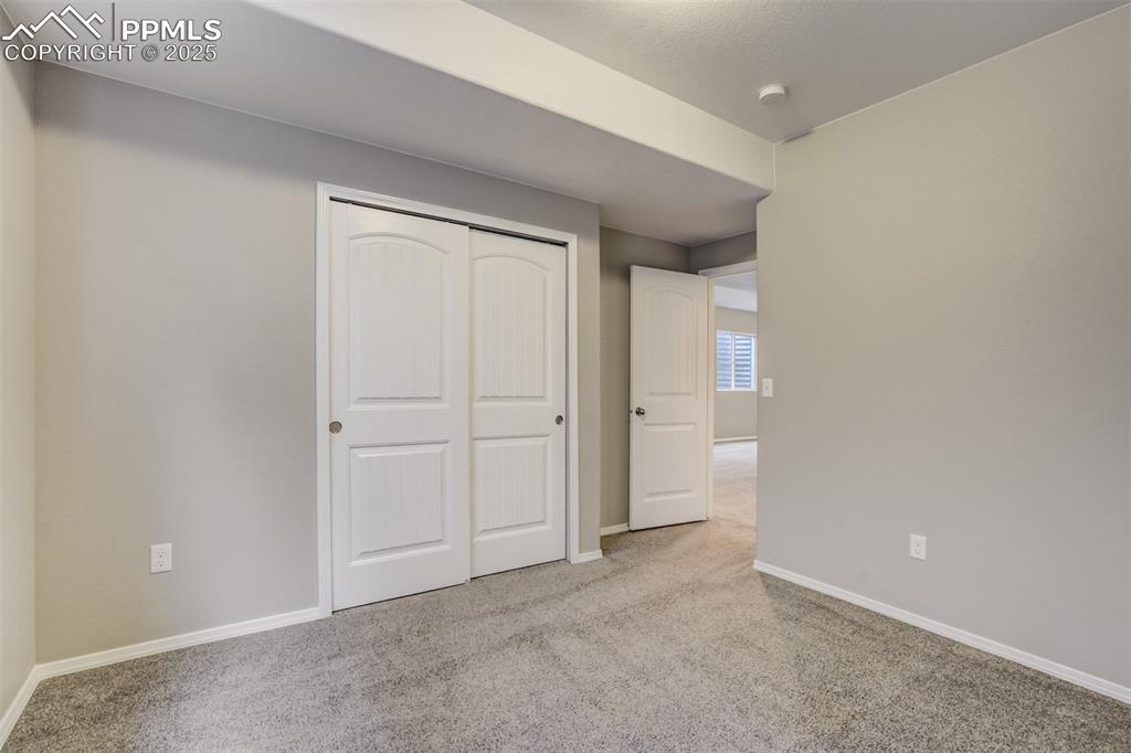 3410 Daydreamer Drive Colorado Springs, CO 80908 - Photo 43 of 50 a view of an empty room and closet area