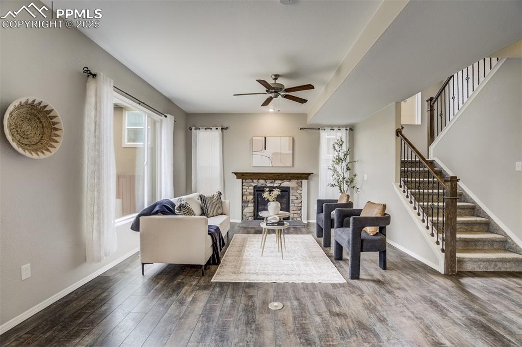 3410 Daydreamer Drive Colorado Springs, CO 80908 - Photo 10 of 50 a living room with furniture and a wooden floor