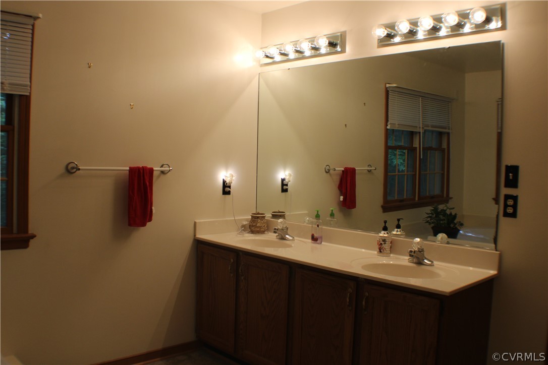 8901 Woodpecker Road Chesterfield, VA 23838 - Photo 17 of 46 First floor primary bath with a jetted tub, separa