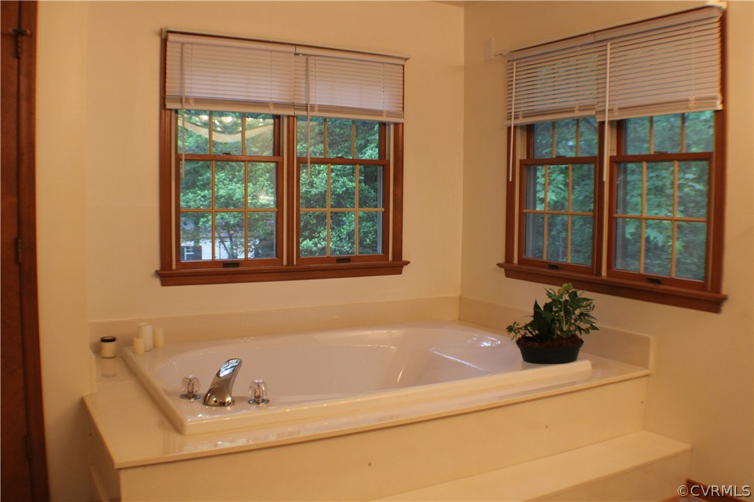 8901 Woodpecker Road Chesterfield, VA 23838 - Photo 18 of 46 First floor primary bath with a jetted tub, separa