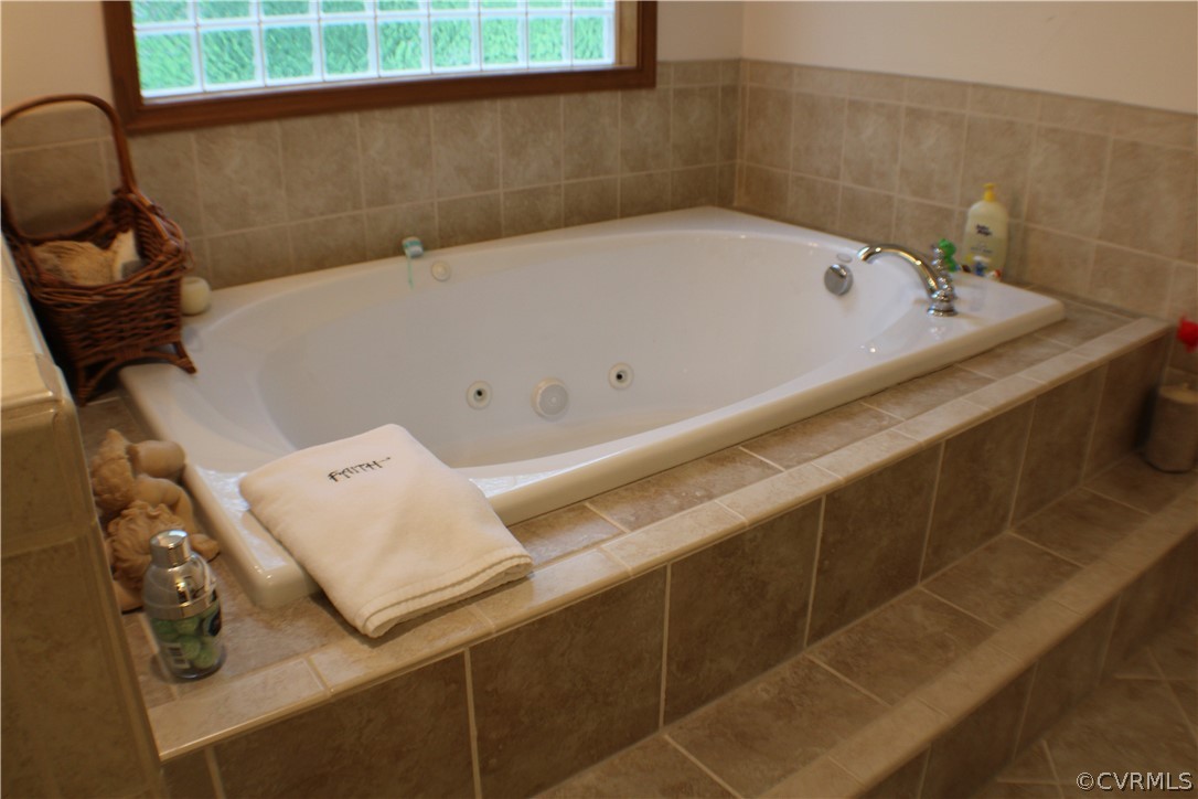 8901 Woodpecker Road Chesterfield, VA 23838 - Photo 25 of 46 Second floor primary bath with jetted tub, separat
