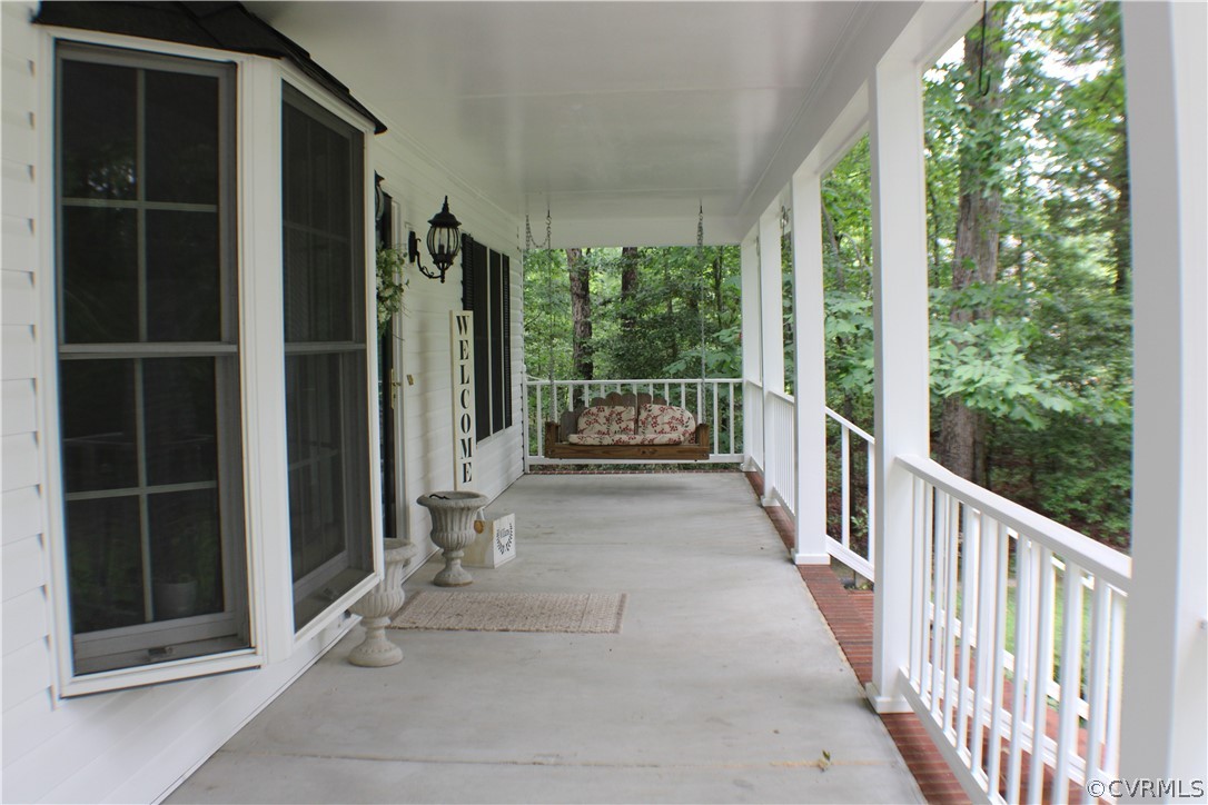 8901 Woodpecker Road Chesterfield, VA 23838 - Photo 5 of 46 Almost a 37' x 8' full front country porch welcom