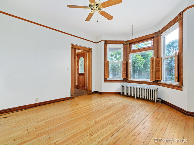 Undisclosed Address Chicago, IL 60613 - Photo 3 of 22 a view of an empty room with a window