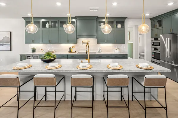 a view of a dining room with furniture and chandelier