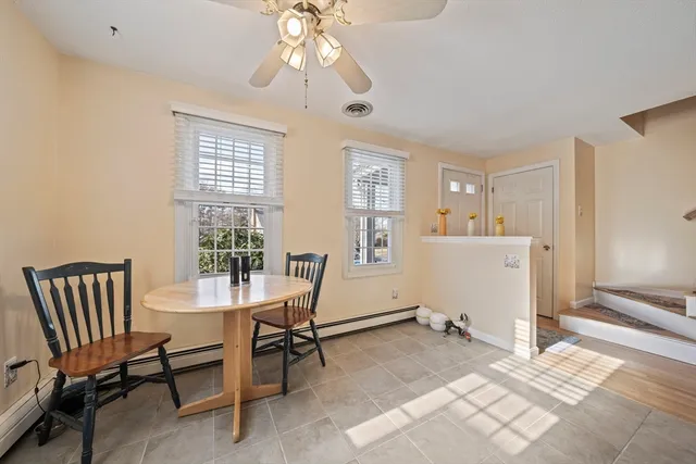 a view of a livingroom with furniture and a window