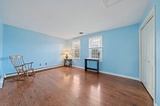 an empty room with furniture and windows