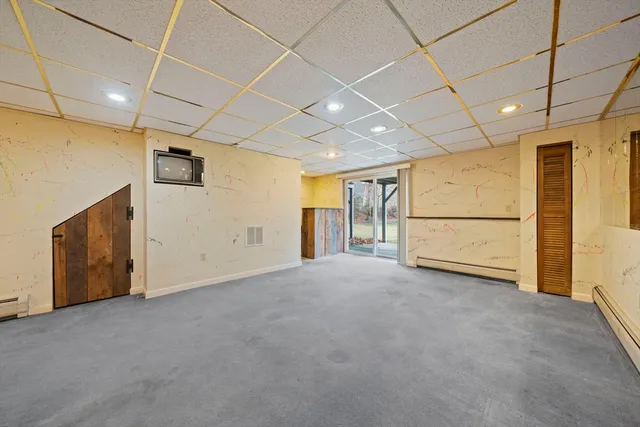 a view of an empty room with a fireplace