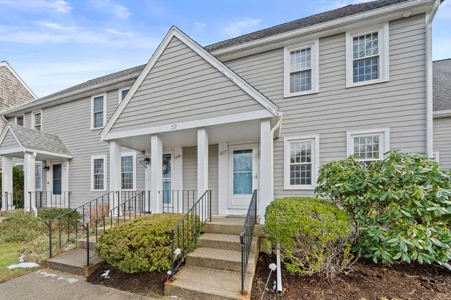 front view of a house with a garden