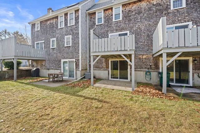 a view of a house with a yard and sitting space